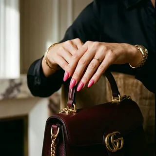 Editorial high-fashion photography of almond-shaped nails in a vibrant Pink Pepper pink color